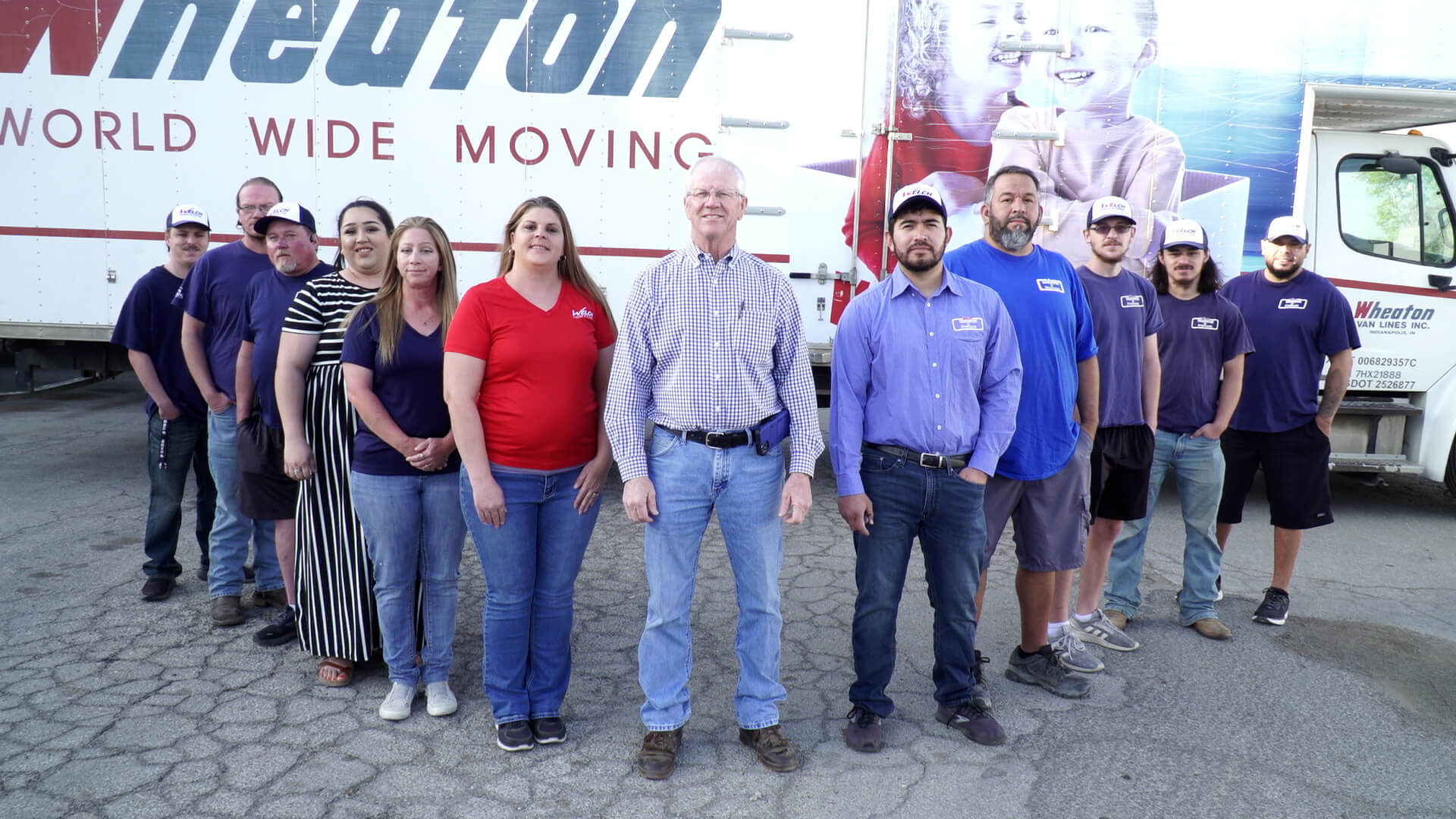 people standing in front of a truck